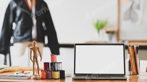 Preview: Workspace fashion designer with laptop computer, thread, pencil and dummy wood on desk.
