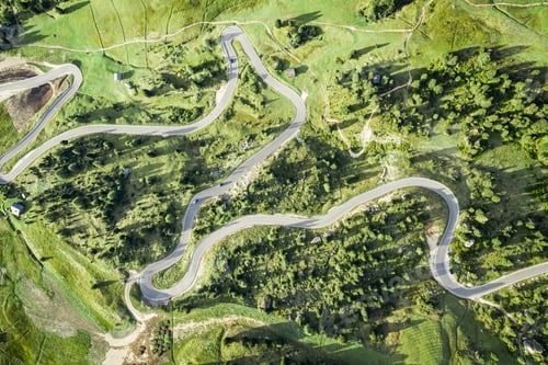 Preview: Top down view of winding road at Passo Gardena, Dolomites