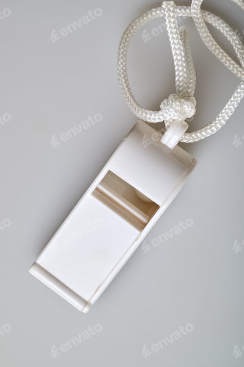 Preview: White plastic sport whistle with cord on white background