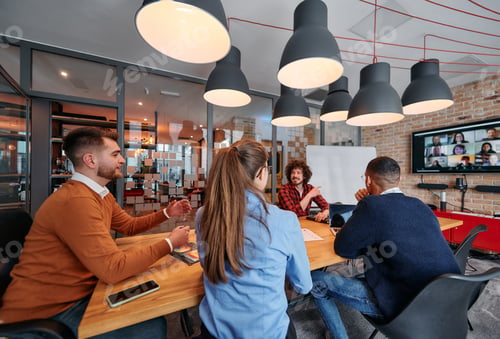 Preview: A diverse team of business professionals engage in discussions on various projects and develop new