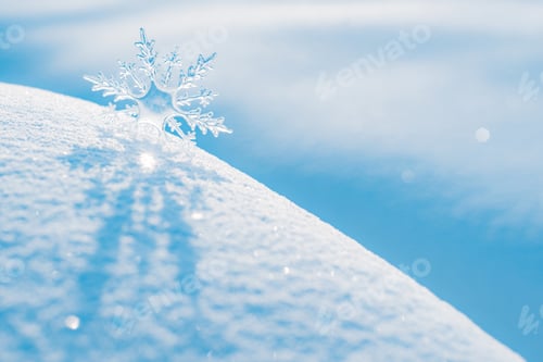 Preview: transparent decorative snowflake on snow outdoors in sunlight