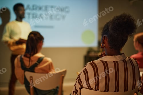 Preview: Young Woman In Audience Back View