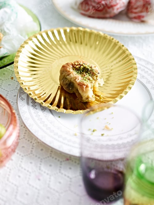 Preview: Baklava on an ornate gold plate.