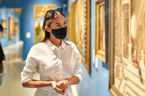 Preview: Woman Visitor Wearing An Mask In Museum Looking At Pictures