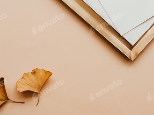 Preview: Minimal aesthetic composition with golden tray and white cards and two yellow leaves