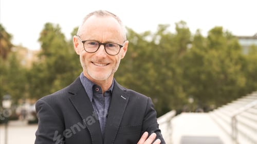 Preview: Portrait of smiling mature businessman with confident look