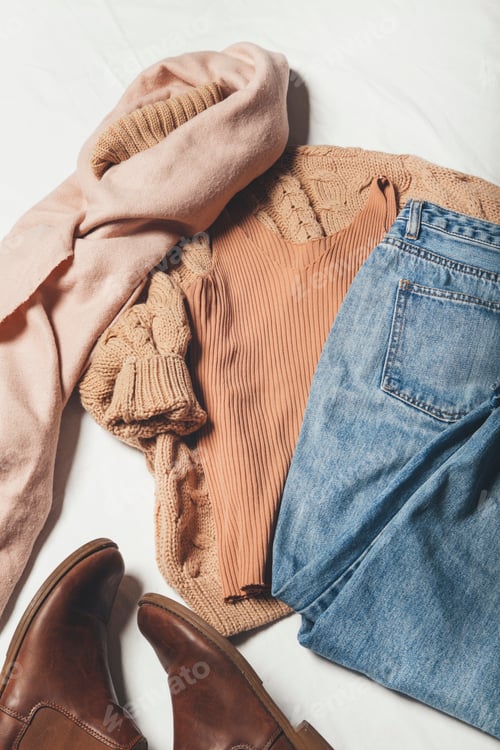 Preview: winter clothes on a white background, cozy winter