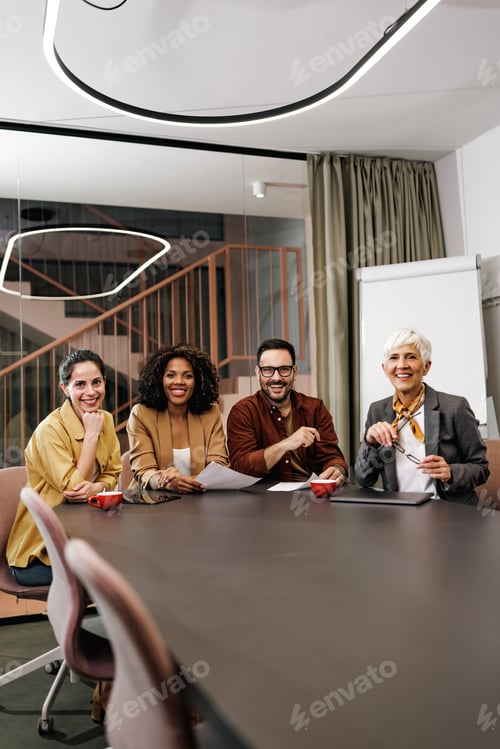 Preview: Portrait of a smiling business people, looking at the camera, preparing for the meeting.