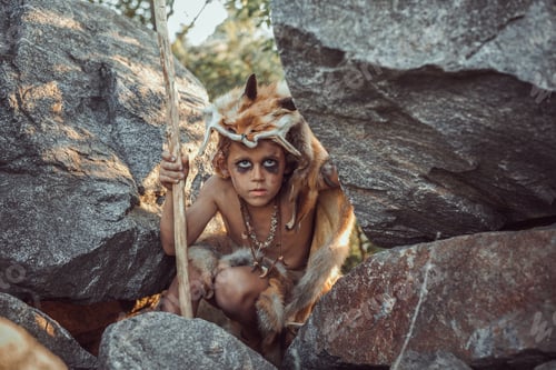 Preview: Caveman, manly boy hunting outdoors. Ancient warrior portrait.