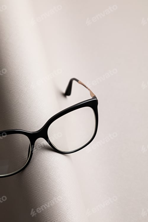Preview: Stylish eyeglasses over pastel background. Optical store, glasses selection, eye test, vision