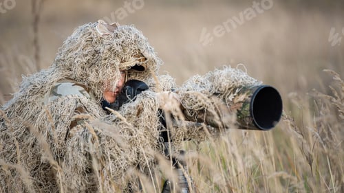 Preview: Wildlife photographer in the ghillie suit working