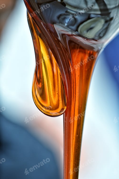 Preview: Natural bee pollinated Kashmiri Royal Sidr Honey sweetly dripping from a ladle.