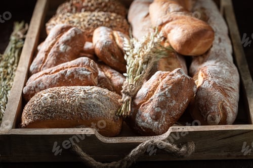 Preview: Wooden Tray of Various Crusty Loaves and Grains