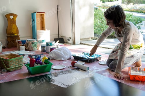 Preview: Girl in garage painting with paint roller