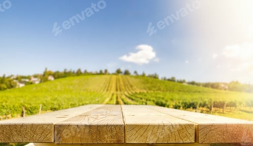 Preview: Empty tabletop against vineyard advertising concept