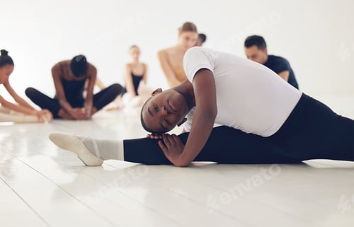 Preview: Shot of a group of ballerinas warming up before practicing their routine
