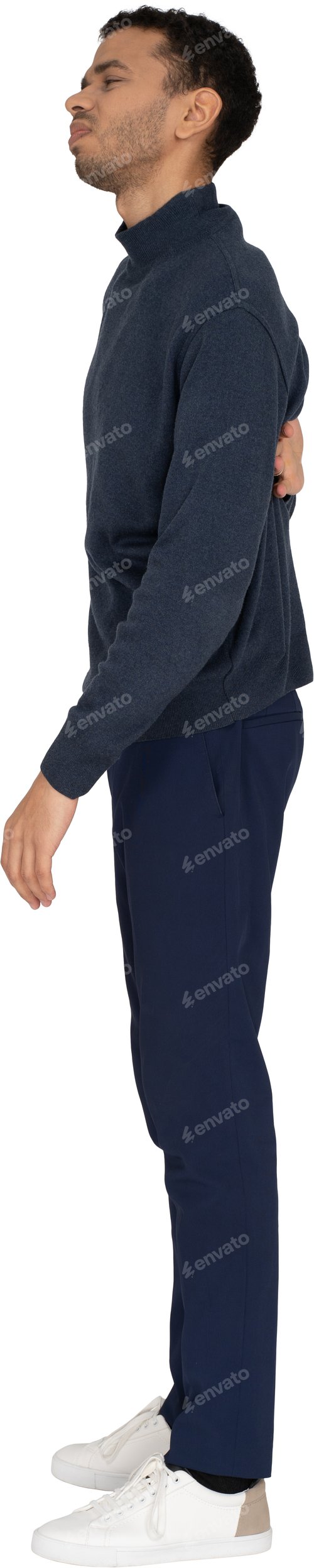 Preview: a man in a blue suit and a hat with his arms crossed