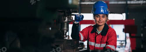 Preview: Portrait of Industrial worker inspecting and check up machine at factory machines.