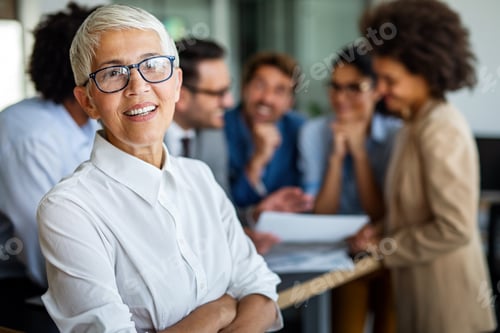 Preview: Group of multiethnic business people working at busy modern office
