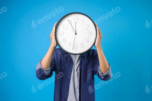 Preview: College Man Wear Casual Style Holding And Showing Clock
