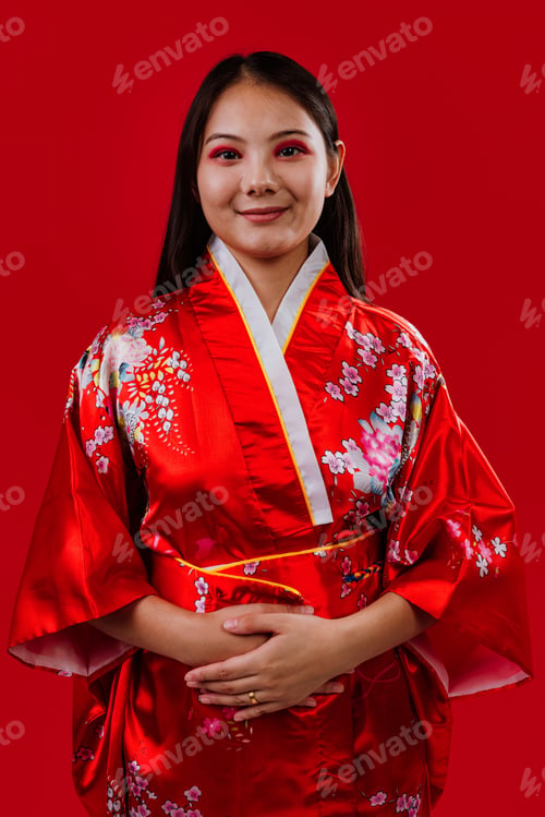 Preview: Young asian woman wearing traditional floral kimono smiling