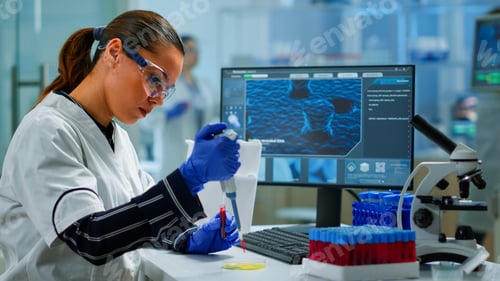 Preview: Research scientist using micropipette to extract blood sample on petri dish
