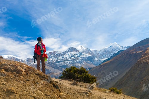 Preview: Woman Hiking in the Mountains on Sunny Day