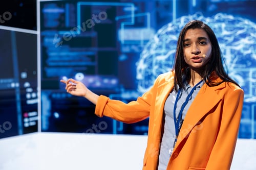 Preview: Speaker talking on stage in event bringing together leading AI specialists