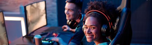 Preview: Female gamer happy with her game in cyber club