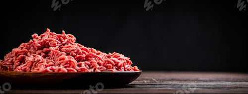 Preview: Fresh minced meat on the table on a plate.