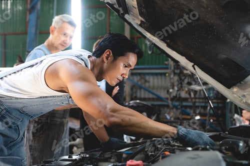 Preview: customer talking with professional mechanic worker or workshop owner, client checking a maintenance