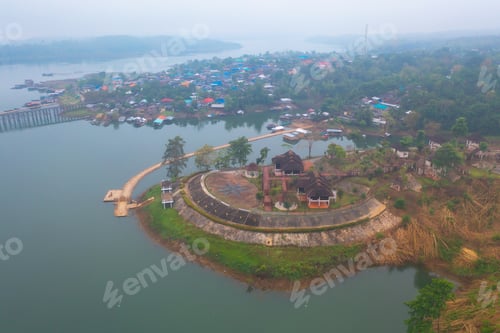 Preview: Aerial top view of houses in Mon village, Kanchanaburi, Thailand in urban city town in Asia