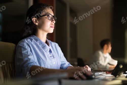 Preview: Hispanic Woman Working at Night