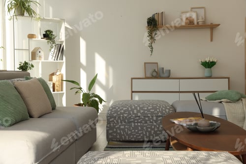 Preview: Stylish sofa and other furniture in living room. Interior design