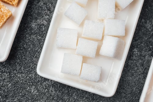 Preview: White sugar cubes arranged neatly on a serving tray ready for desserts