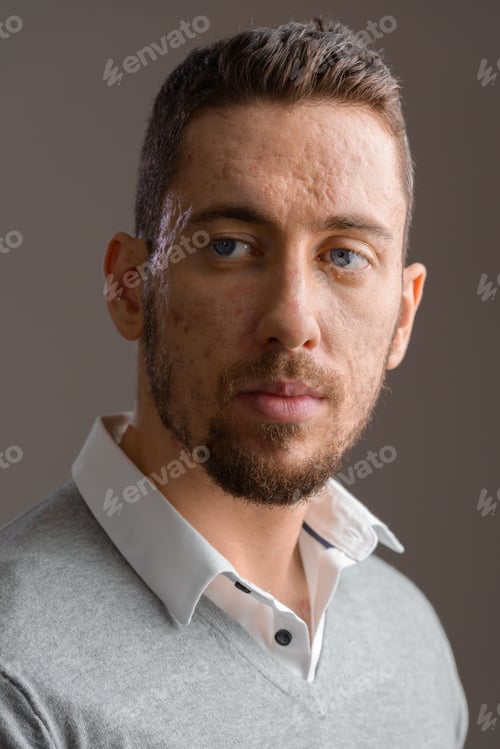 Preview: Face of young handsome Caucasian man thinking