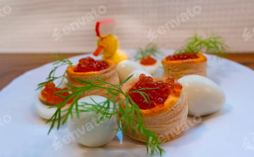 Preview: Closeup of caviar and cream cheese appetizer on crackers
