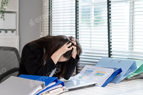 Preview: Frustrated Mixed race businesswoman overwork late in office workplace.