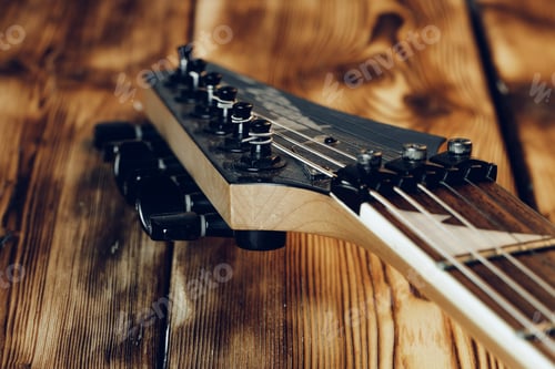 Preview: Guitar headstock with tuners on dark background