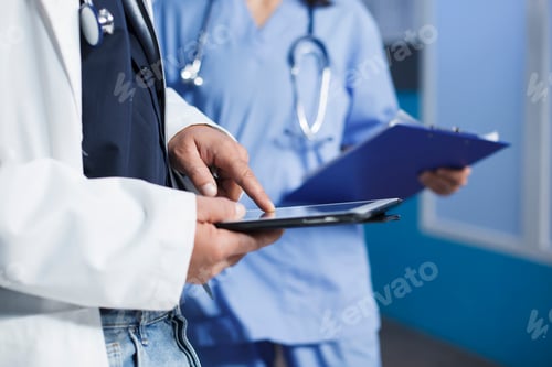 Preview: A person with lab coat holding a tablet