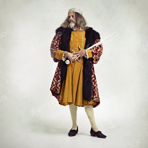 Preview: Wielding the sword of kings. Studio shot of a richly garbed king holding a sword.