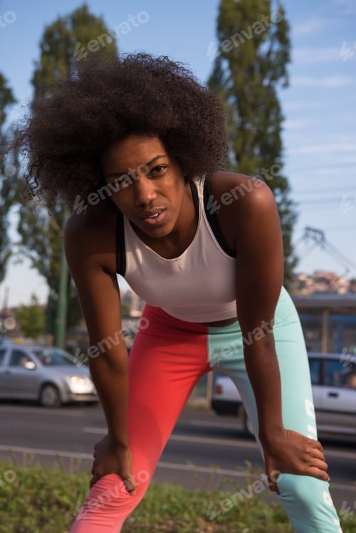 Preview: Portrait of sporty young african american woman running outdoors