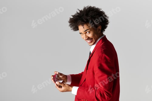 Preview: Young man in elegant attire proposes with a ring and a charming smile