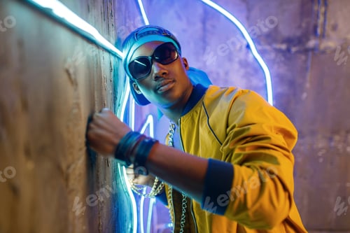 Preview: Black rapper in underpass neon light on background