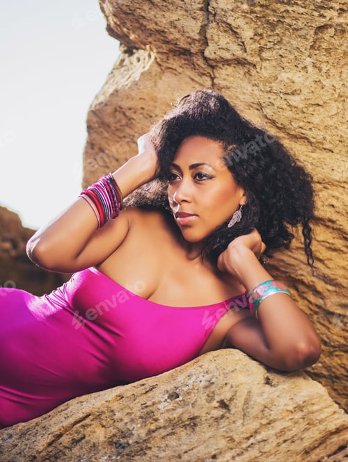 Preview: Beautiful Afro American woman in sexy swimsuit posing on the beach at summer