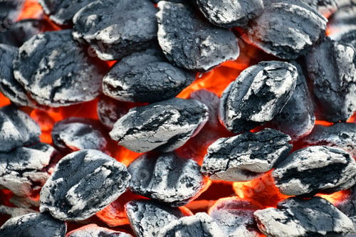 Preview: Charcoal briskets on fire. Hot and almost ready to grill over.