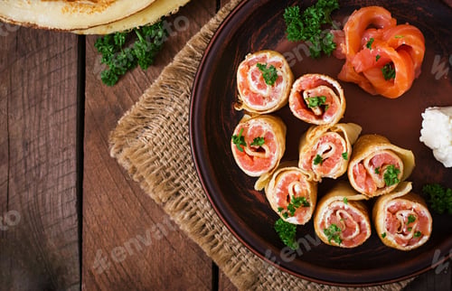 Preview: Appetizing pancakes with salmon and cream cheese "Philadelphia". Top view