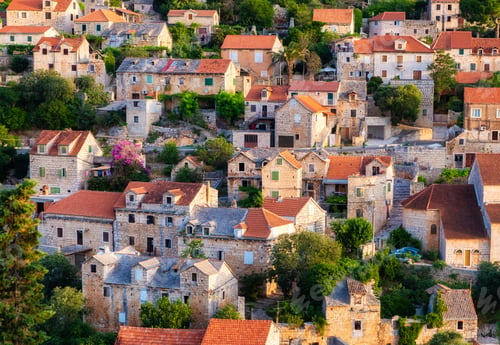 Preview: Croatia. Old town, street and trees as a background. Houses on the mountain hill.