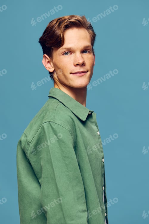 Preview: Stylish Young Man Rocks a Confident Smile in Studio Portrait