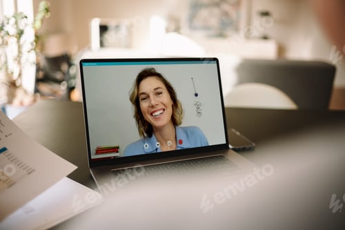 Preview: Businesswoman on a video call with her colleague